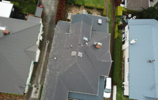 Roof covered in moss and mould, showing significant growth before professional moss and mould treatment.