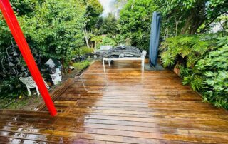 Freshly cleaned wooden deck surface showing restored natural wood color after professional cleaning by Metro Water Blasting.
