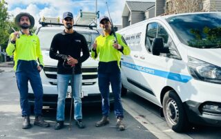 Metro Water Blasting technicians performing house washing service at a residential property.