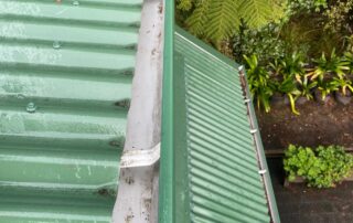 Gutter fully cleaned and cleared of moss, dirt, and debris after professional service.